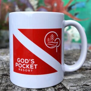 white mug with red international dive flag and Gods pocket logo on the front